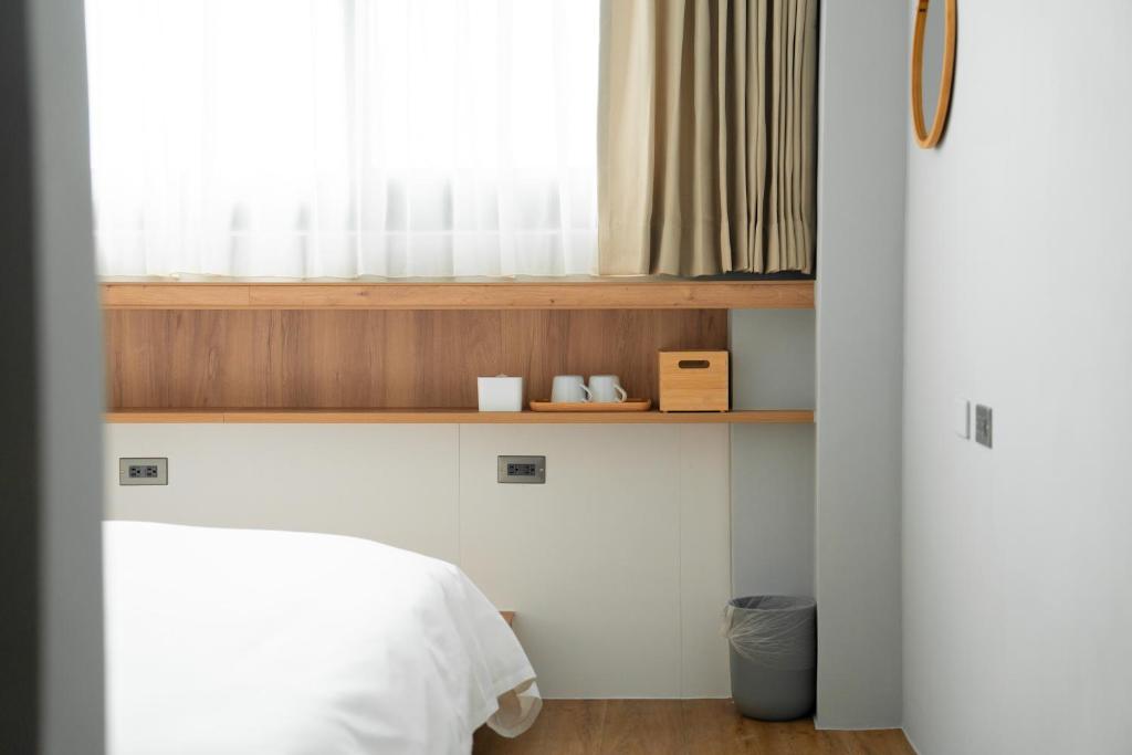 Postel nebo postele na pokoji v ubytování Norden Ruder Hostel Taitung Branch 2