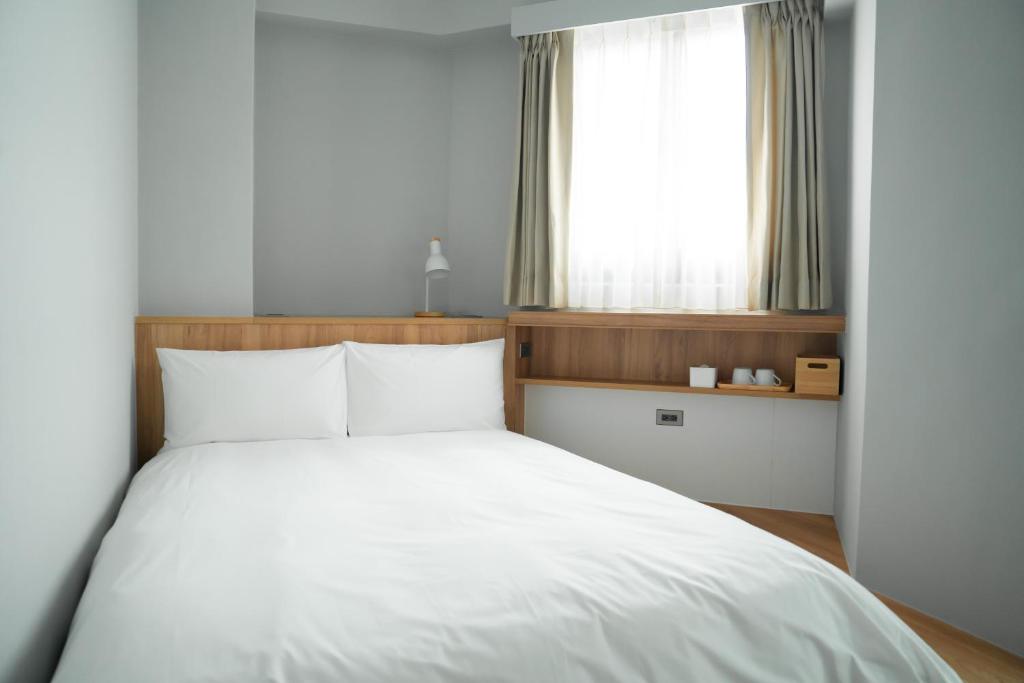 Postel nebo postele na pokoji v ubytování Norden Ruder Hostel Taitung Branch 2