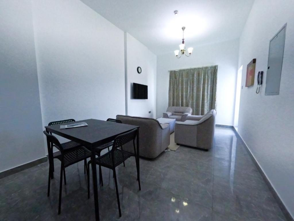 TV a/nebo společenská místnost v ubytování Warsan Star Residence - Home Stay