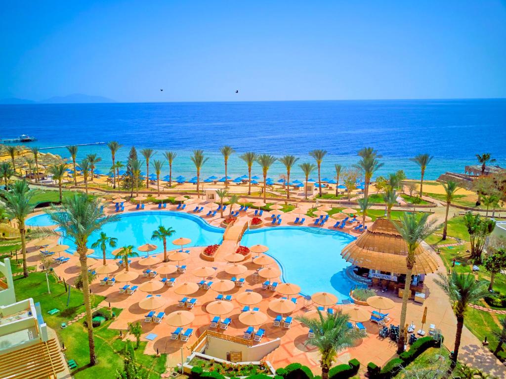 an aerial view of a resort with a pool and the ocean at Pickalbatros Royal Grand Sharm - Adults Friendly 16 Years Plus in Sharm El Sheikh