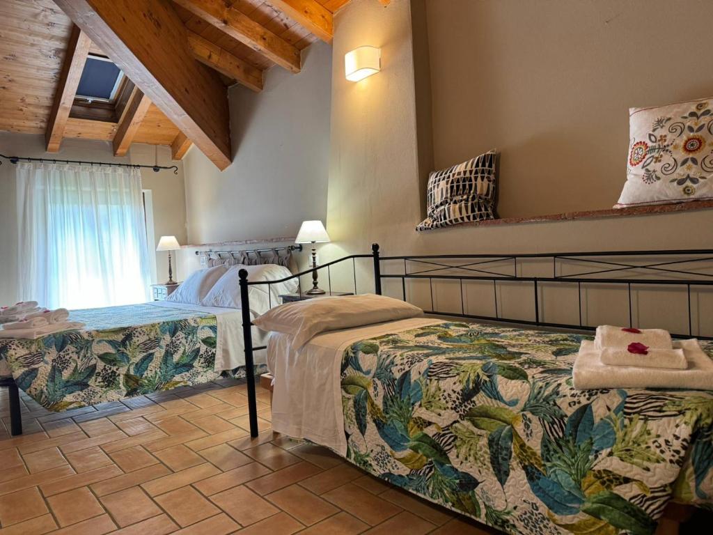 Postel nebo postele na pokoji v ubytování Villa dei Mulini