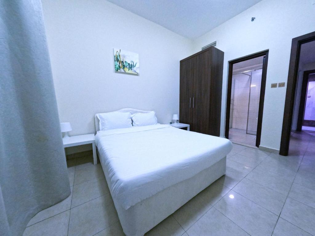Letto o letti in una camera di Barsha Star Residence - Home Stay