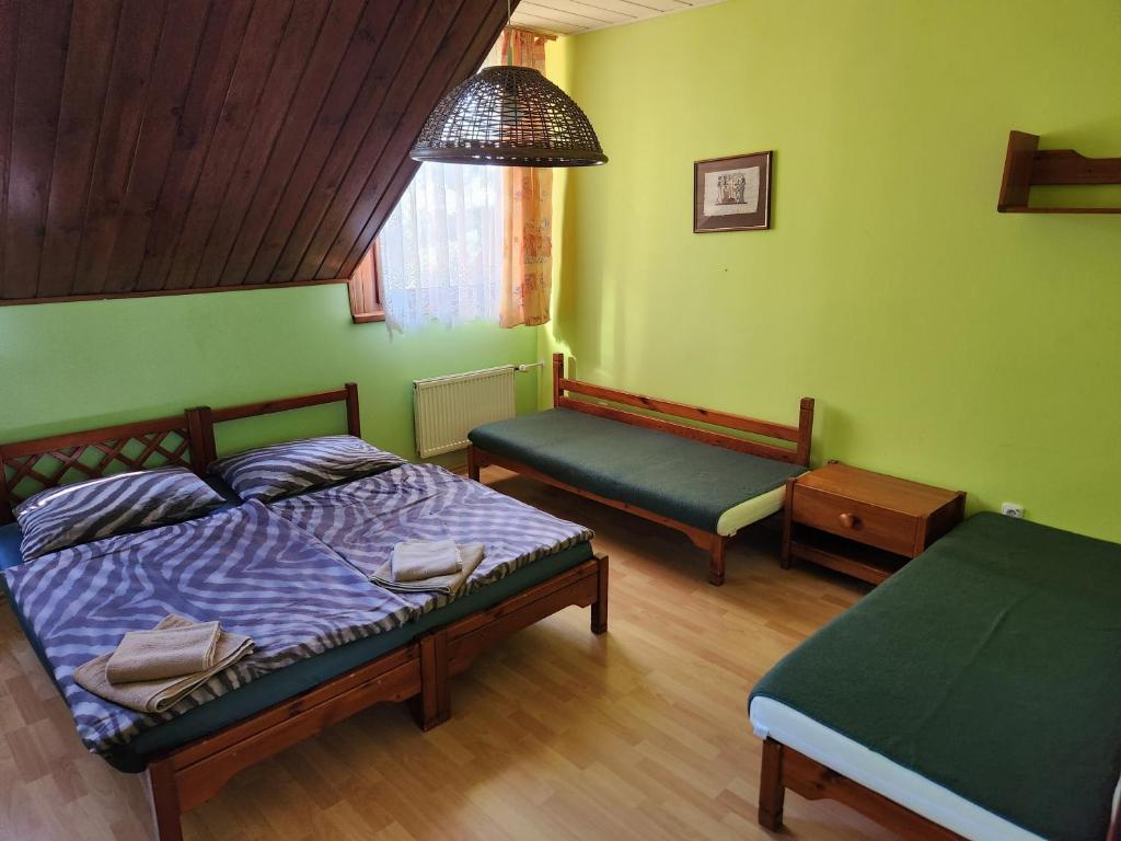 Postel nebo postele na pokoji v ubytování Hotel Autis