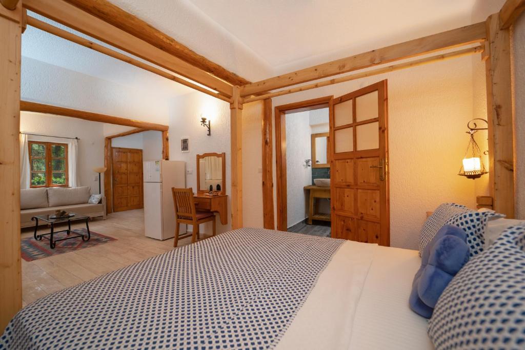 A bed or beds in a room at Watermill Villa & Hotel Faralya