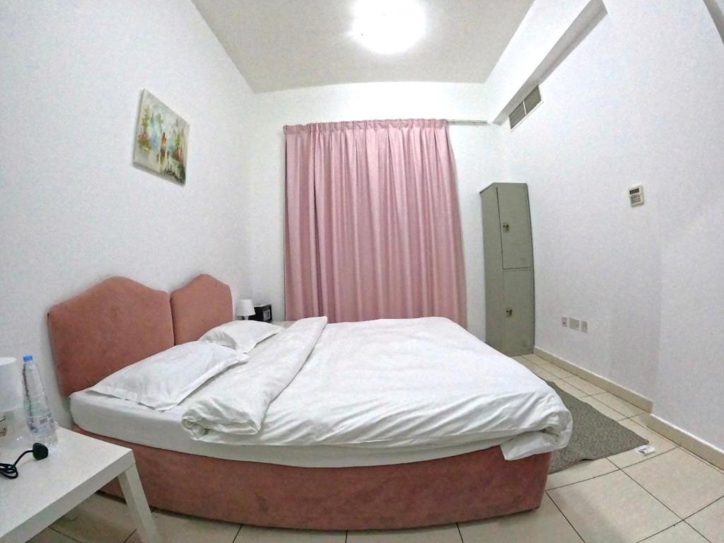 Postel nebo postele na pokoji v ubytování Al Badaa Star Residence - Home Stay