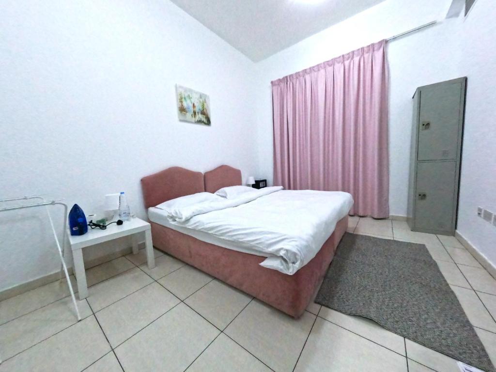 Postel nebo postele na pokoji v ubytování Al Badaa Star Residence - Home Stay