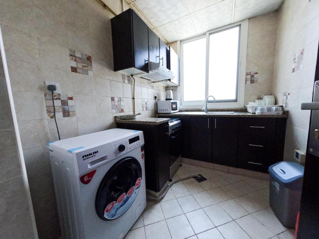 Kuchyň nebo kuchyňský kout v ubytování Al Badaa Star Residence - Home Stay