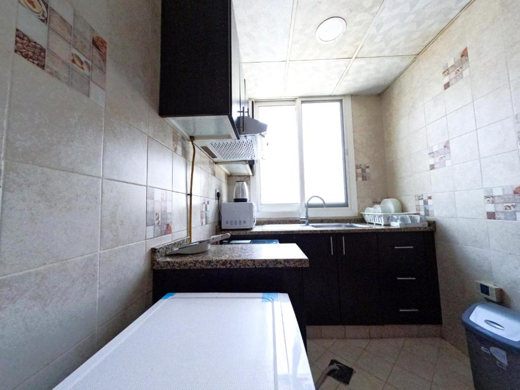 Kuchyň nebo kuchyňský kout v ubytování Al Badaa Star Residence - Home Stay