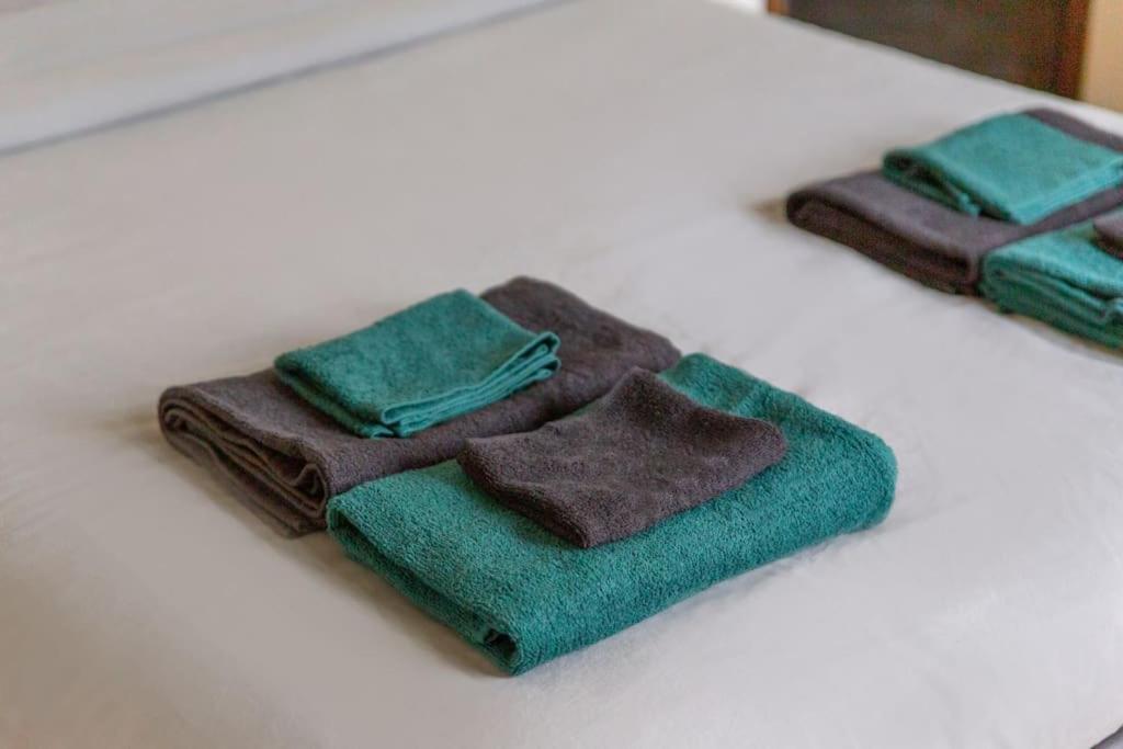 two brown towels sitting on a white table at Appartement entier au coeur de Nogent Sur Marne in Nogent-sur-Marne