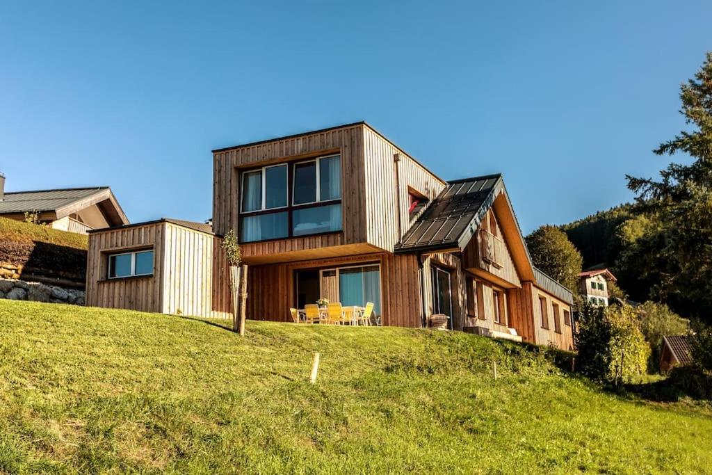 a house on top of a grassy hill at Feldhasen in Bad Ischl