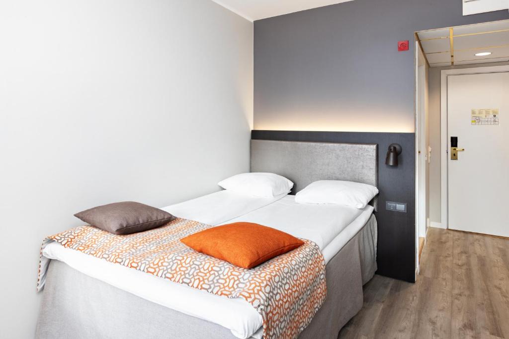 Postel nebo postele na pokoji v ubytování Quality Hotel Augustin