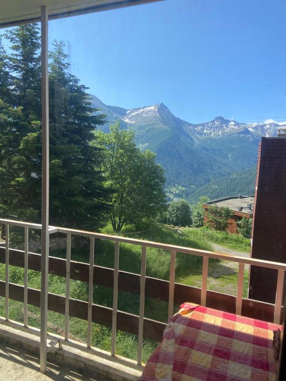 a view of a mountain view from a balcony at BEL APPARTEMENT MONTAGNE AVEC VUE in Orcières