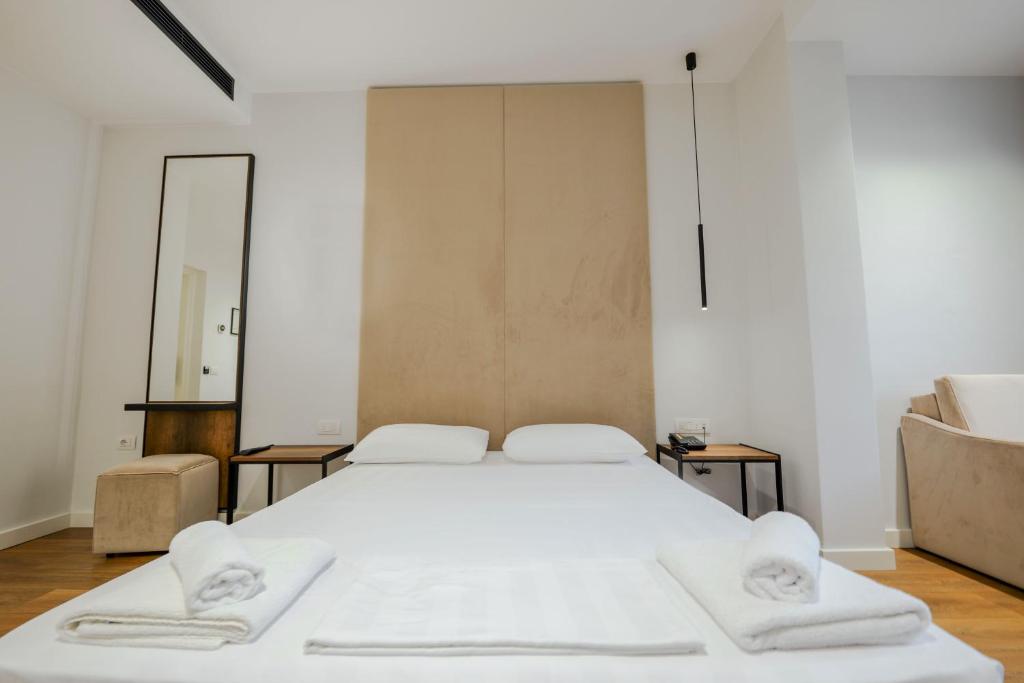 Postel nebo postele na pokoji v ubytování Hotel Central