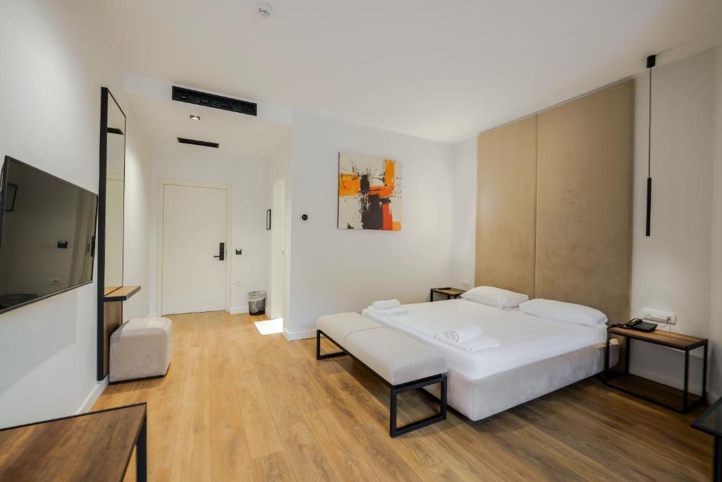 Postel nebo postele na pokoji v ubytování Hotel Central