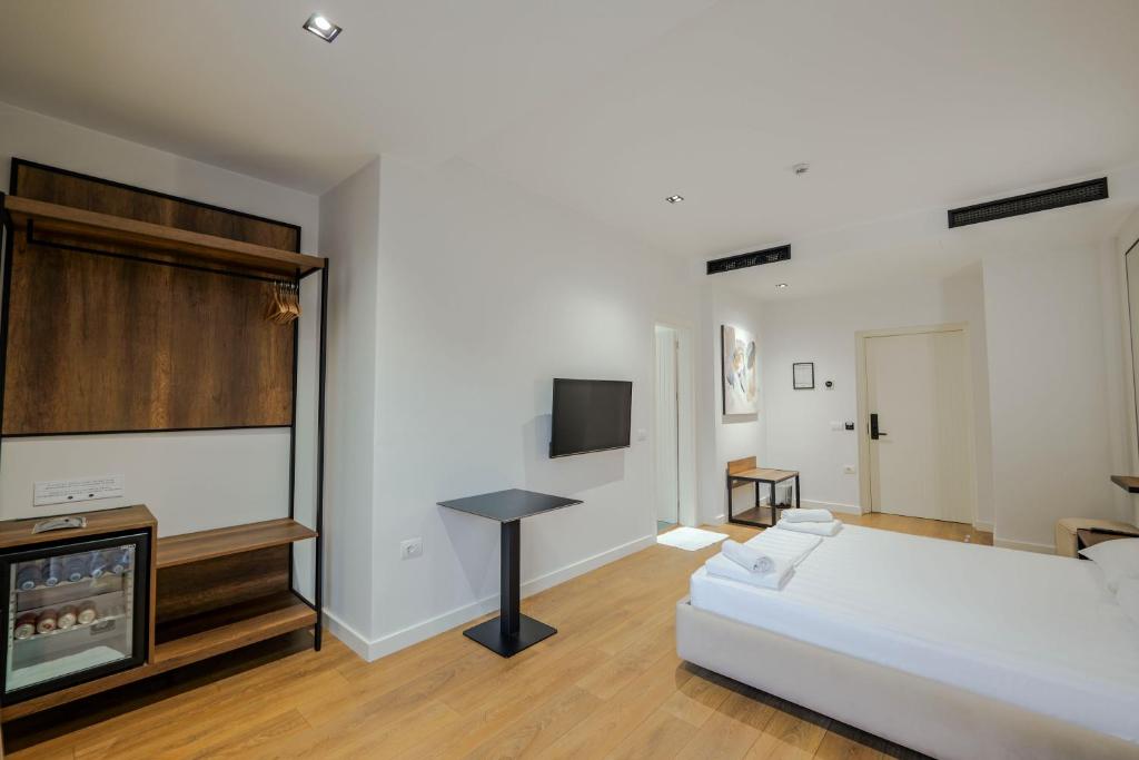 Postel nebo postele na pokoji v ubytování Hotel Central