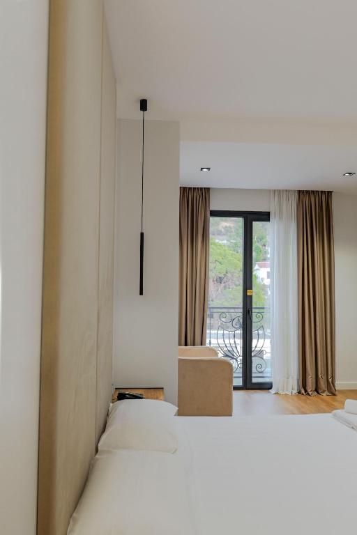Postel nebo postele na pokoji v ubytování Hotel Central