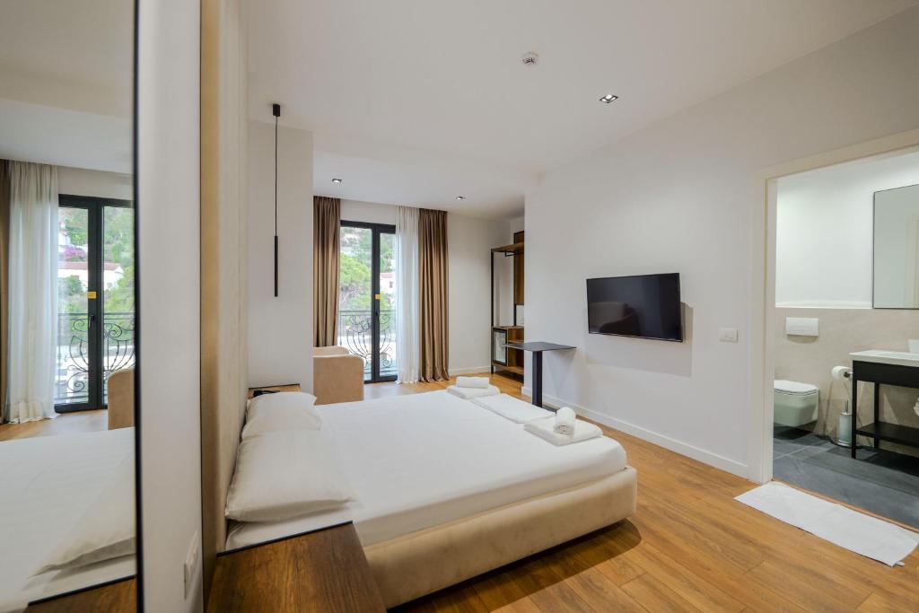 Postel nebo postele na pokoji v ubytování Hotel Central
