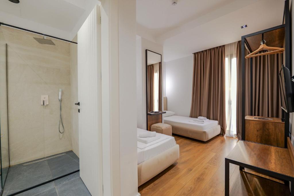 Postel nebo postele na pokoji v ubytování Hotel Central