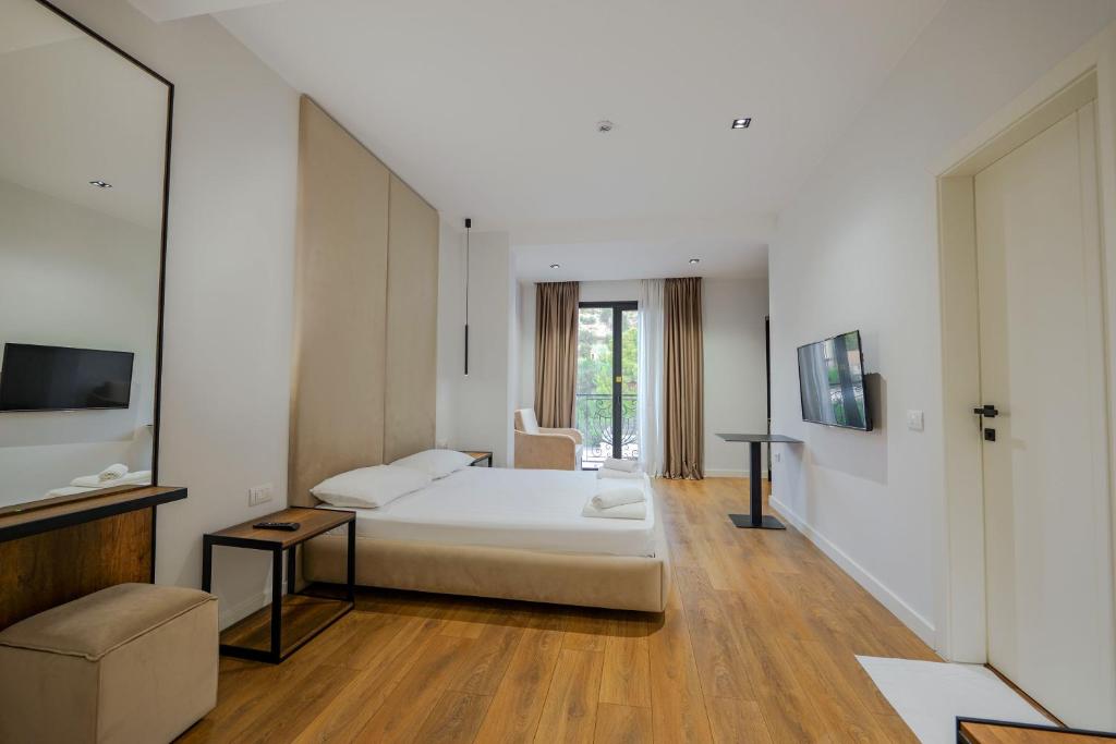 Postel nebo postele na pokoji v ubytování Hotel Central