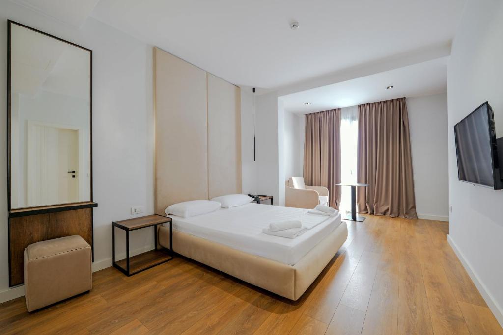 Postel nebo postele na pokoji v ubytování Hotel Central