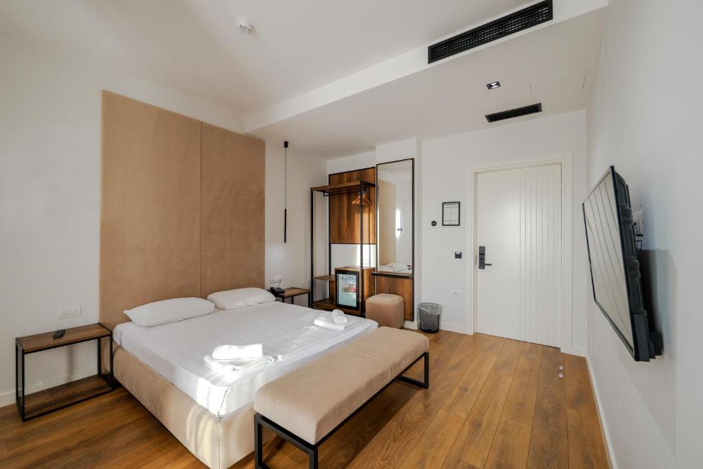Postel nebo postele na pokoji v ubytování Hotel Central