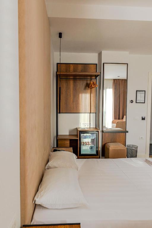 Postel nebo postele na pokoji v ubytování Hotel Central