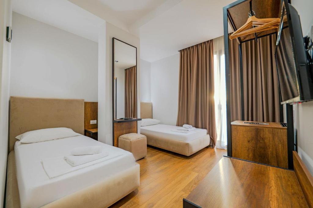 Postel nebo postele na pokoji v ubytování Hotel Central