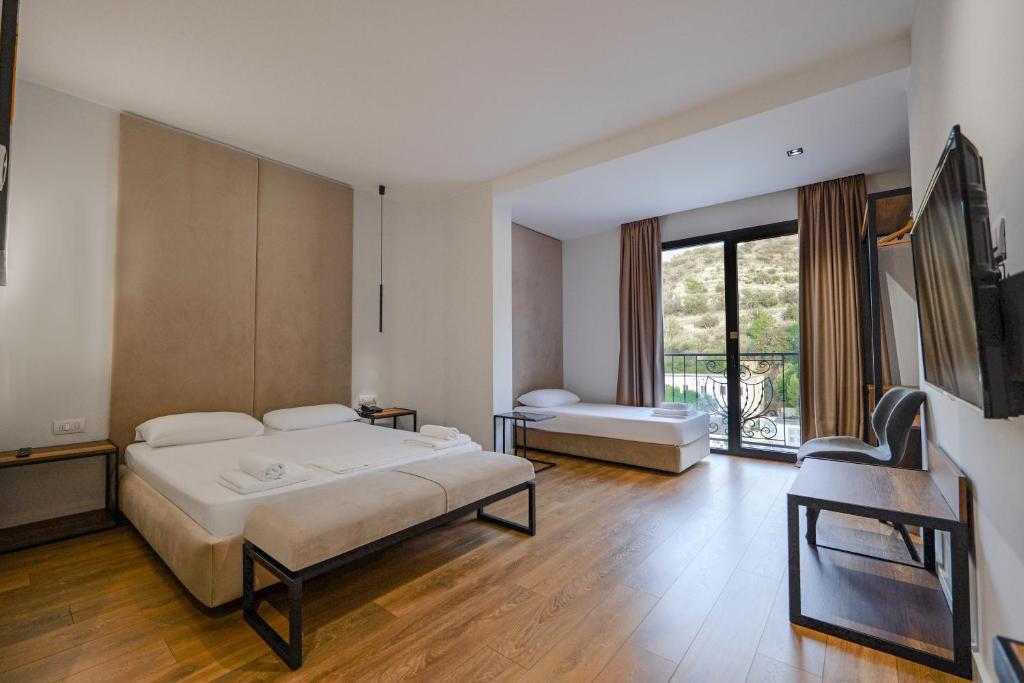 Postel nebo postele na pokoji v ubytování Hotel Central