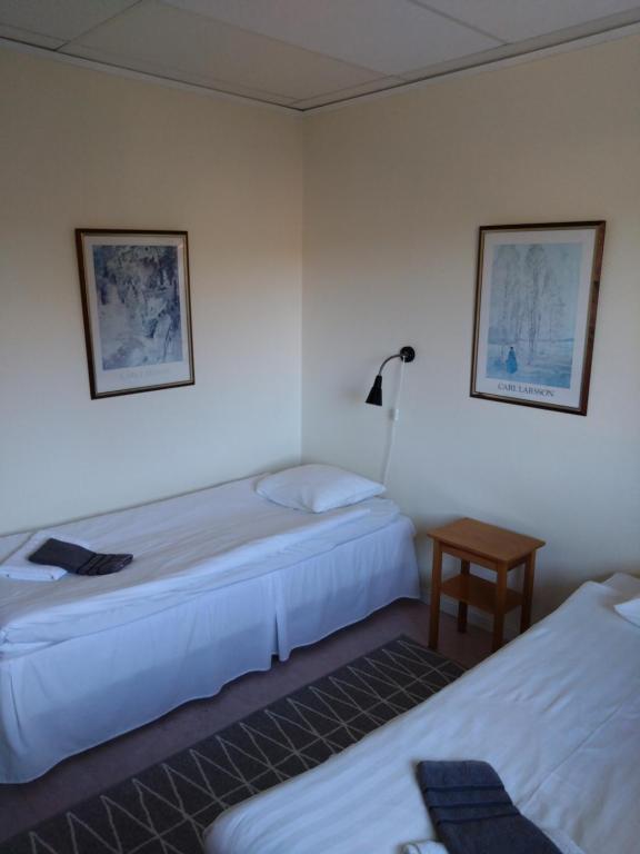 Postel nebo postele na pokoji v ubytování Hotell Hemgården