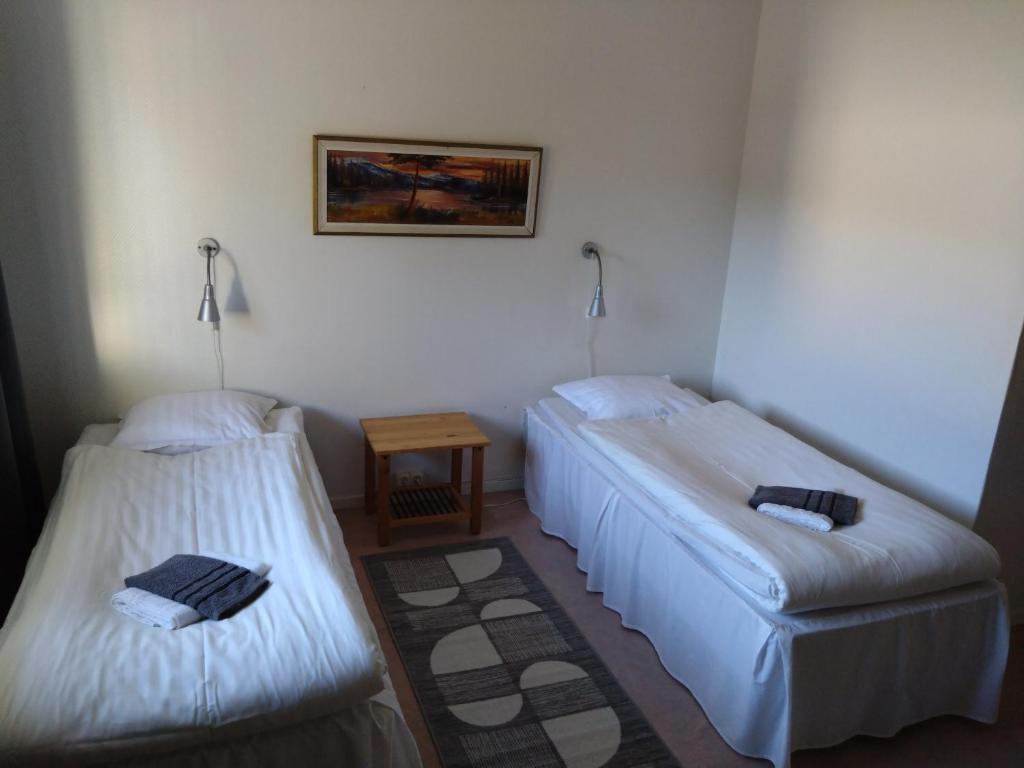 Postel nebo postele na pokoji v ubytování Hotell Hemgården
