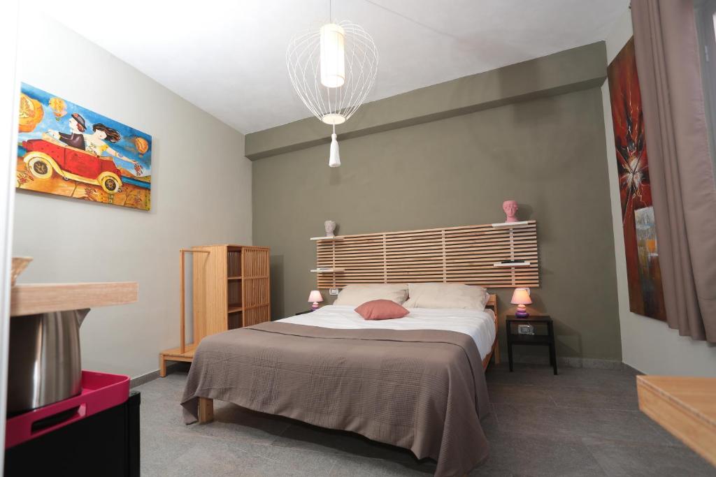 Postel nebo postele na pokoji v ubytování Oikia Atenea Automatic Rooms