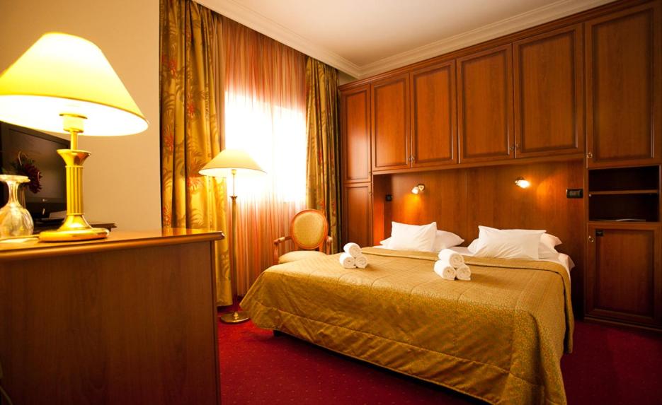 Postel nebo postele na pokoji v ubytování Hotel Globo