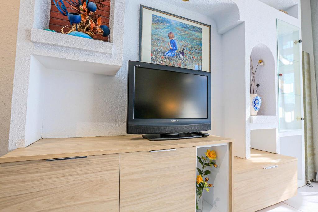 Televízia a/alebo spoločenská miestnosť v ubytovaní LITORAL COSTA DORADA - CAMBRILS PARK d