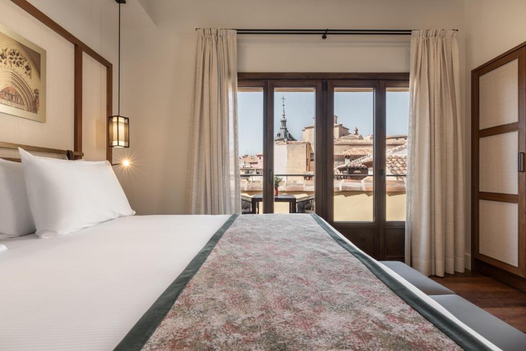 Postel nebo postele na pokoji v ubytování Áurea Toledo by Eurostars Hotel company