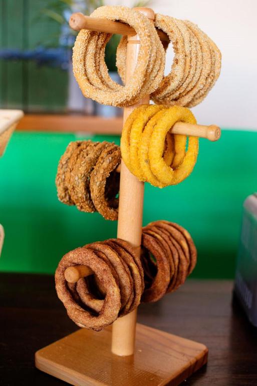 a pile of ropes on a wooden stick at Varos Village Boutique Hotel in Város