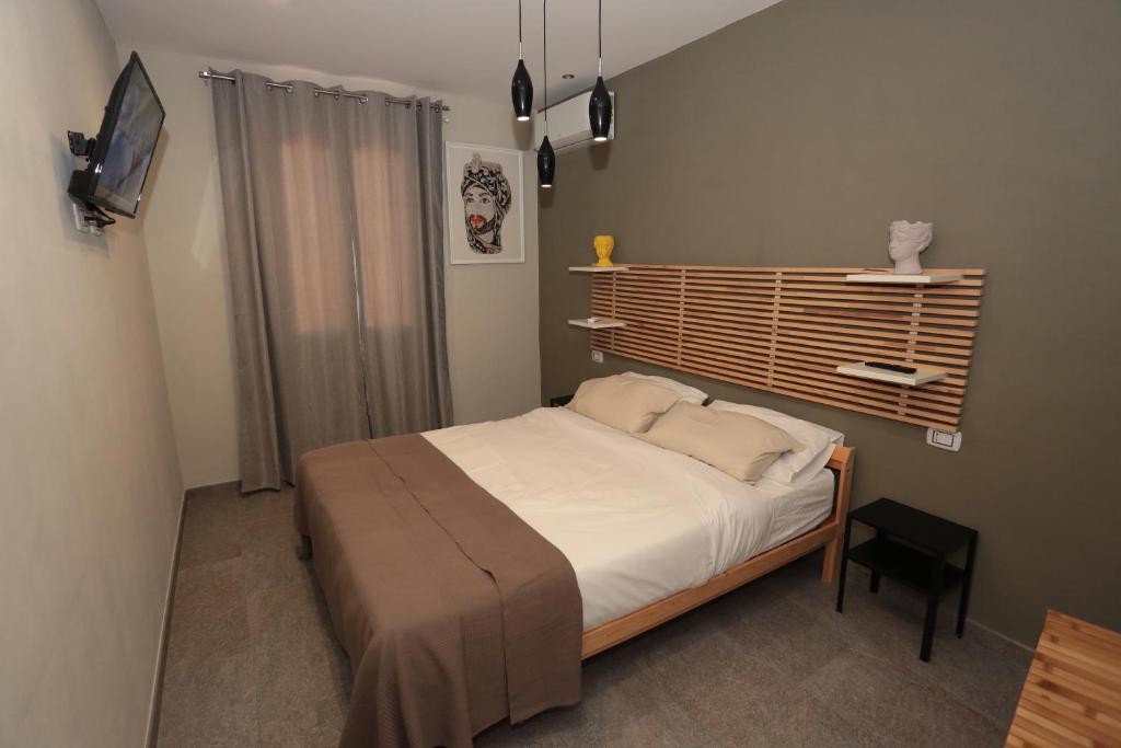 Postel nebo postele na pokoji v ubytování Oikia Atenea Automatic Rooms