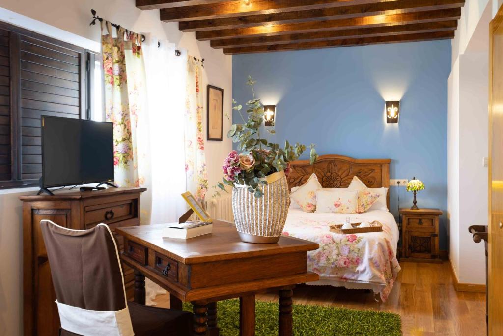 Postel nebo postele na pokoji v ubytování Posada de Eufrasio