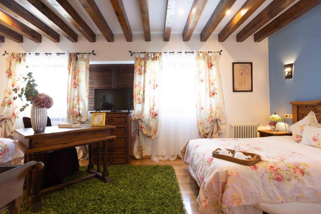Postel nebo postele na pokoji v ubytování Posada de Eufrasio