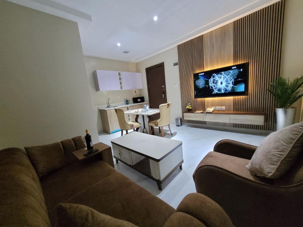 TV a/nebo společenská místnost v ubytování Carlton Swiss Grand Hotel