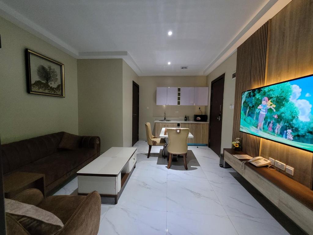 TV a/nebo společenská místnost v ubytování Carlton Swiss Grand Hotel