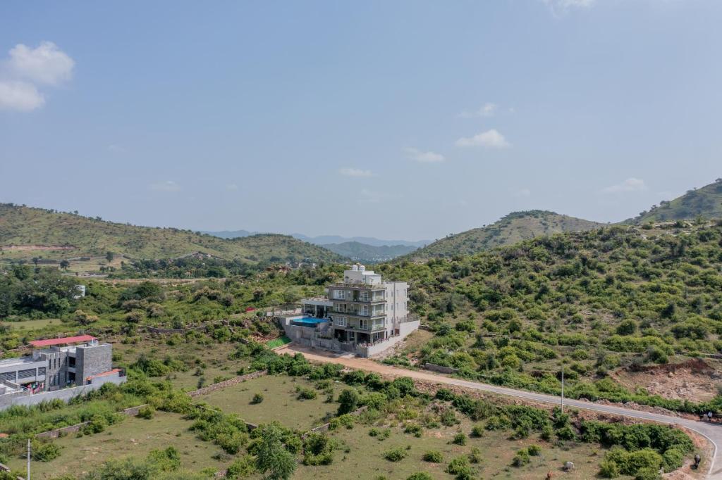 an aerial view of a building on a mountain at SURAMYA-A Luxury Boutique Hotel in Udaipur