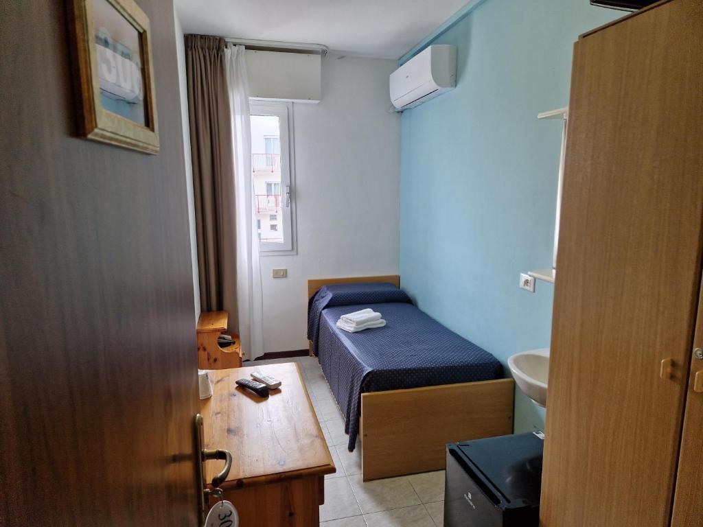 A bed or beds in a room at Hotel Danubio