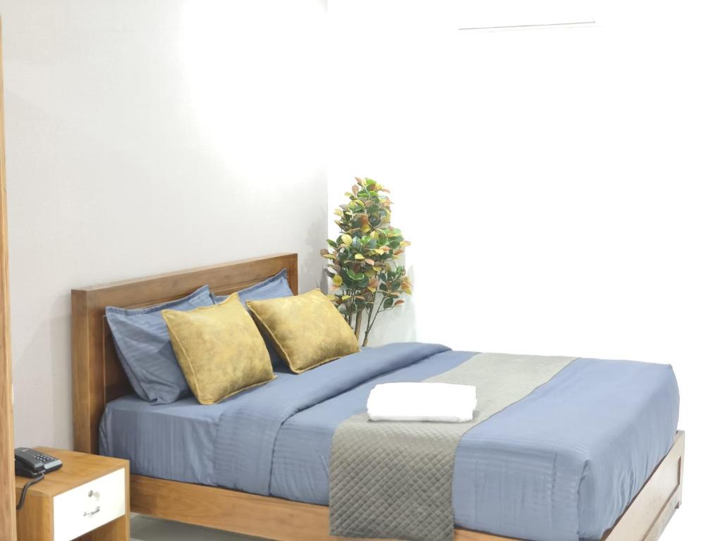 Postel nebo postele na pokoji v ubytování Wayanad Palace