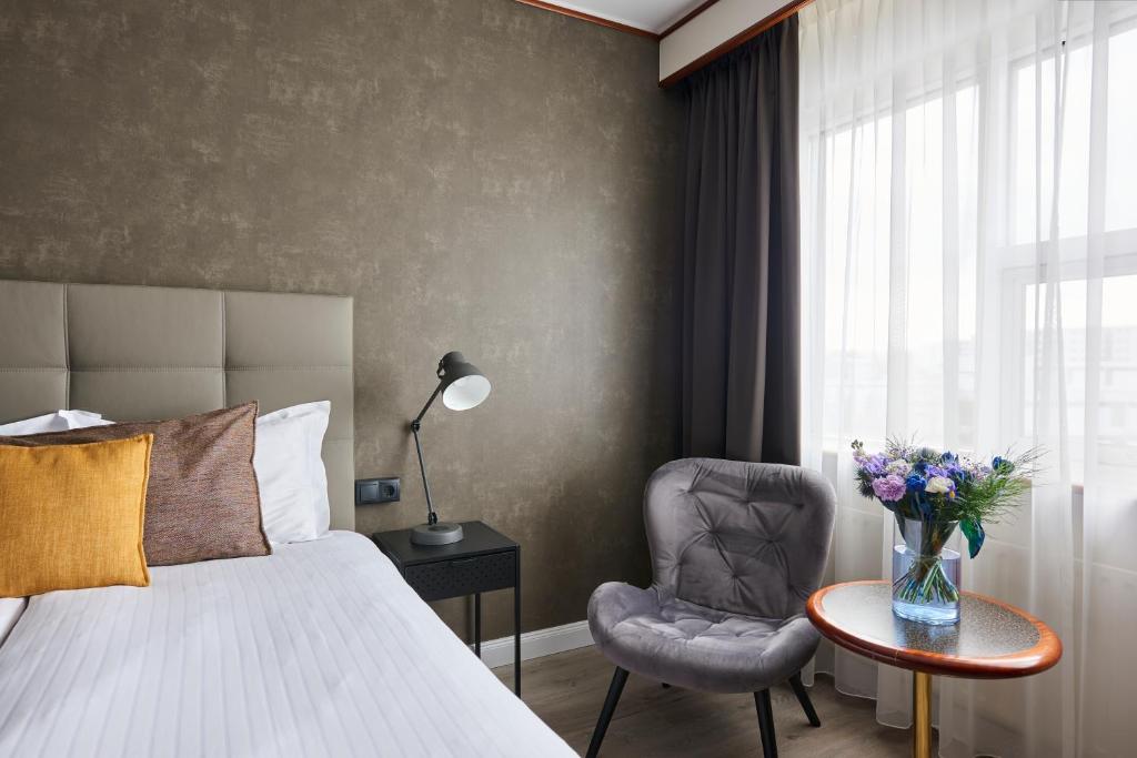 Postel nebo postele na pokoji v ubytování Hotel Ísland – Spa & Wellness Hotel