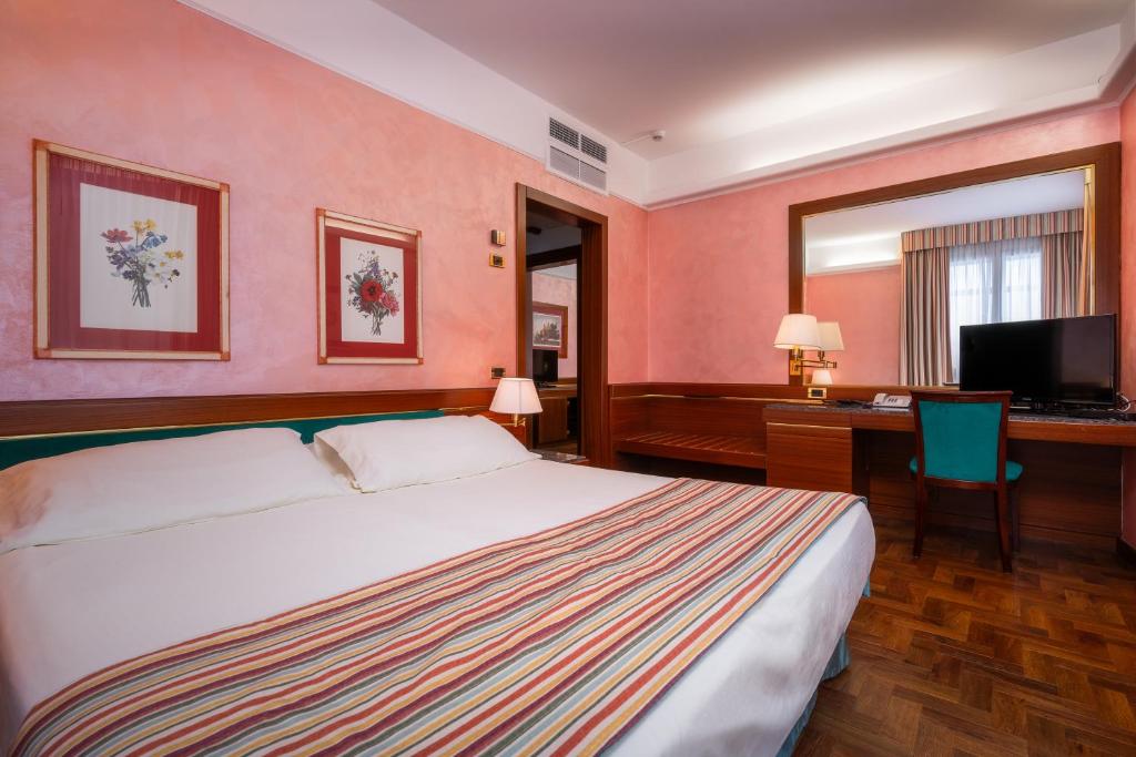 Postel nebo postele na pokoji v ubytování Hotel Crivi's