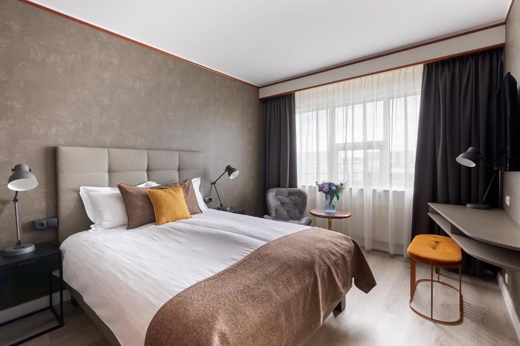 Postel nebo postele na pokoji v ubytování Hotel Ísland – Spa & Wellness Hotel