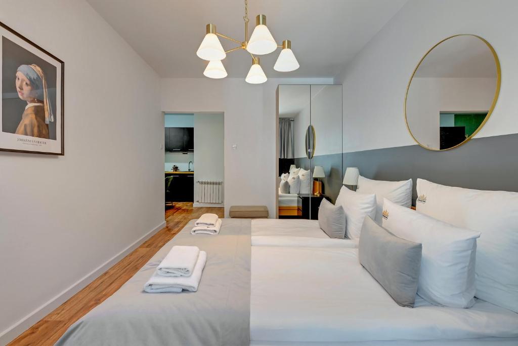 Posteľ alebo postele v izbe v ubytovaní Aura Island Riverside by Downtown Apartments