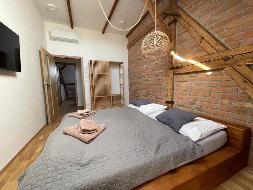 Postel nebo postele na pokoji v ubytování Apartmány Marienhof