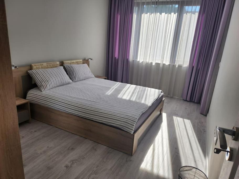 Postel nebo postele na pokoji v ubytování Harmony apartment
