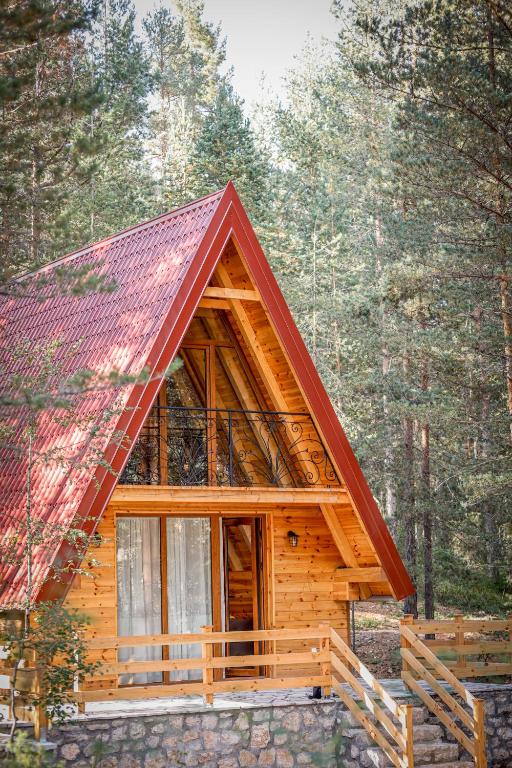 a cabin in the woods with a red roof at Peace of mind in Žabljak